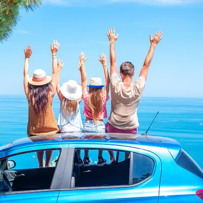 Rhodes Car Rental and Driving: Everything You Need to Know 7 family on a car rental overviewing rhodes sea
